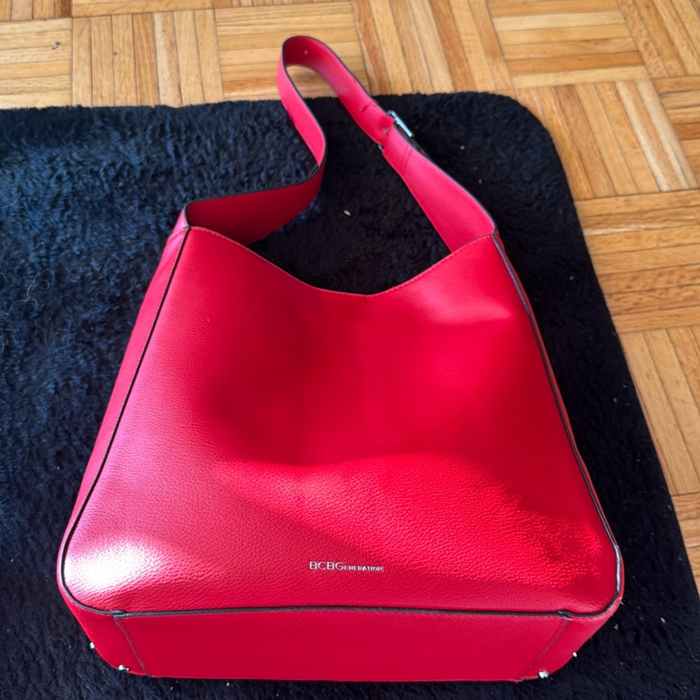 Selling a red bcbg handbag with sliver hardware